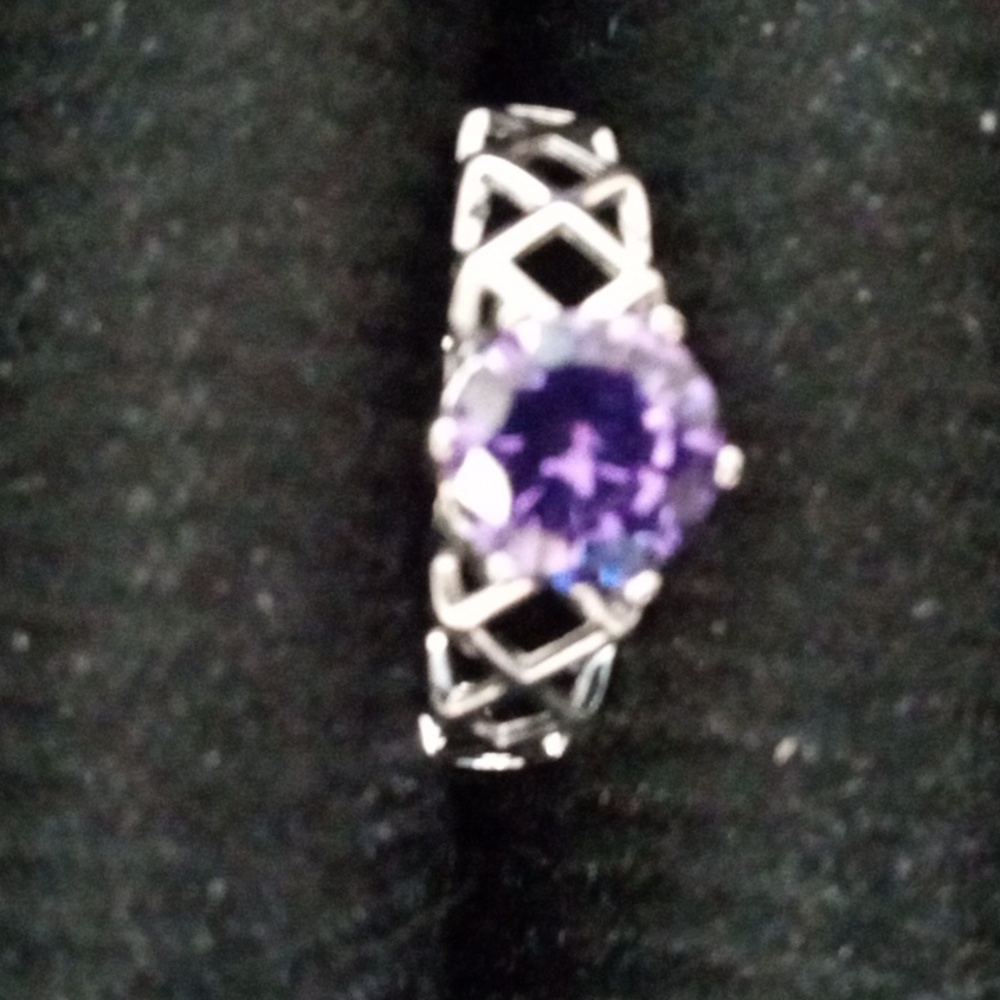 Ring with purple stone. $5 or 5 for $20